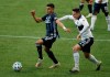 Los Angeles Galaxy midfielder Joe Corona, left, and Vancouver Whitecaps defender Jake Nerwinski battle for the ball during the first half of an MLS soccer match in Portland, Ore., Sunday, Nov. 8, 2020. The Whitecaps have locked up a key piece of their backline, signing veteran right back Nerwinski to a new two-year contract. THE CANADIAN PRESS/AP/Steve Dipaola