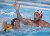 Canada's Nicolas Constantin-Bicari, right, battles USA's Jesse Smith in men's water polo gold medal action at the Pan Am Games in Lima, Peru, Saturday, Aug. 10, 2019. Canada opened the Olympic men's water polo qualification tournament Sunday with an 11-7 victory over Brazil at the Zwemcentrum Rotterdam. THE CANADIAN PRESS/Andrew Vaughan