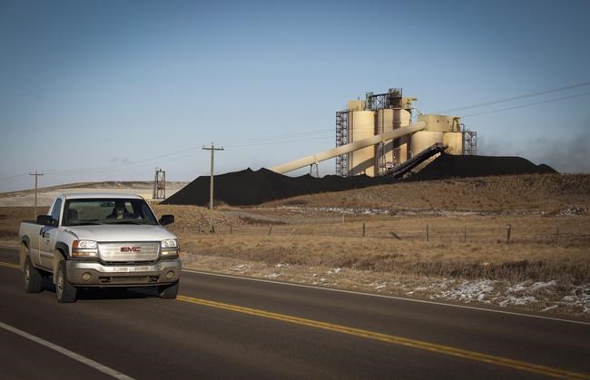 A conveyor belt transports coal at the Westmoreland Coal Co.'s Sheerness Mine near Hanna, Alta., onTuesday, Dec. 13, 2016. One of North America's top experts on coal mine pollution is warning Albertans about the dangers of expanding the industry in the province's Rocky Mountains. THE CANADIAN PRESS/Jeff McIntosh