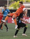 Hamilton Forge FC's Daniel Krutzen (left) grimaces while vying for possession against Antigua FC's Anllei Porras during first-half Scotiabank CONCACAF League soccer action in Hamilton, Ont., Thursday, Aug. 1, 2019. THE CANADIAN PRESS/Peter Power