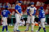 Toronto Blue Jays manager Charlie Montoyo (25) comes to the mound to relieve Jacob Waguespack, center left, during the sixth inning of a baseball game against the Boston Red Sox, Friday, Aug. 7, 2020, in Boston. THE CANADIAN PRESS/AP-Michael Dwyer