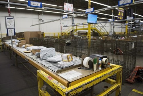 Parcels and mail await delivery in the mail room at the Canada Post Gateway location in Mississauga, Ont., on January 24, 2018. THE CANADIAN PRESS/Nathan Denette