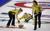 Team Manitoba skip Jennifer Jones makes her last shot against Team Saskatchewan as second Jocelyn Peterman, left, and lead Lisa Weagle sweep at the Scotties Tournament of Hearts in Calgary on February 22, 2021. THE CANADIAN PRESS/Jeff McIntosh