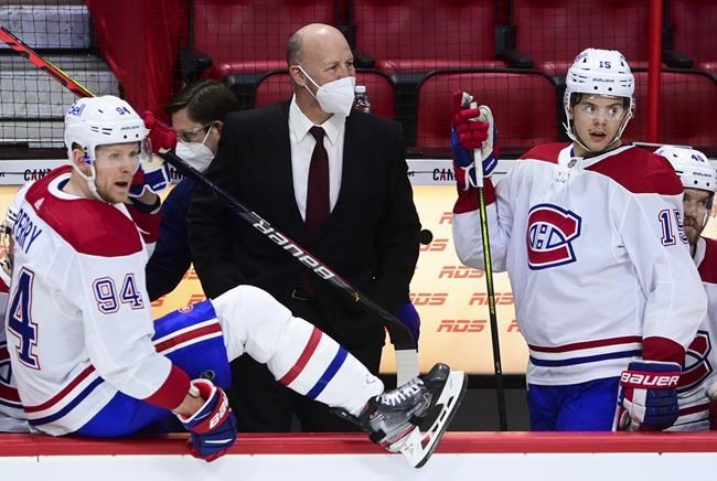 Montreal Canadiens head coach Claude Julien looks towards the ice as his team takes on the Ottawa Senators during second period NHL action in Ottawa on Tuesday, Feb. 23, 2021. The Canadiens have fired head coach Julien and associate coach Kirk Muller. THE CANADIAN PRESS/Sean Kilpatrick