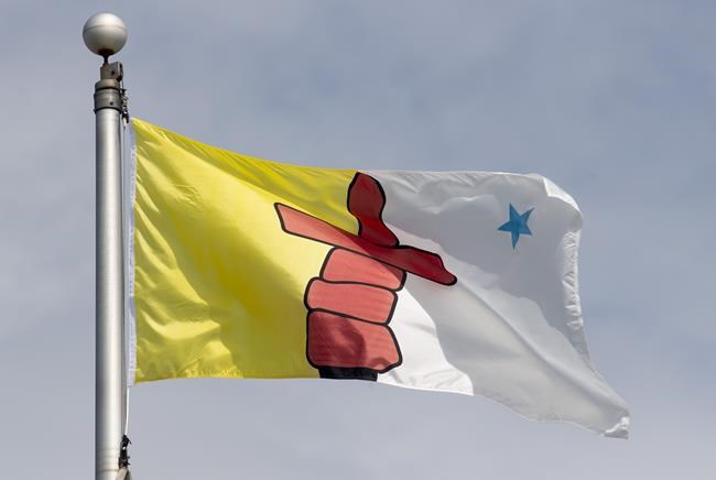 Nunavut's territorial flag flies on a flag pole in Ottawa on Tuesday, June 30, 2020. THE CANADIAN PRESS/Adrian Wyld