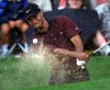 Tiger Woods hits out of a bunker on the 17th hole on his way to winning the Canadian Open Championship at Glen Abbey in Oakville, Ont. on Sunday Sept.10, 2000. THE CANADIAN PRESS/Frank Gunn
