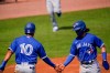 Toronto Blue Jays' Reese McGuire (10) celebrates with Bo Bichette, right, after Bichette scored on a two-run double by Rowdy Tellez during the first inning of a spring baseball game Sunday, Feb. 28, 2021, in Tampa, Fla. THE CANADIAN PRESS/AP, Frank Franklin II