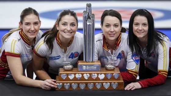 Team Canada, left to right, lead Briane Meilleur, second Shannon Birchard, third Val Sweeting and skip Kerri Einarson celebrates pose with the trophy after defeating Team Ontario in the final at the Scotties Tournament of Hearts in Calgary, Alta., Sunday, Feb. 28, 2021.THE CANADIAN PRESS/Jeff McIntosh