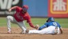 Toronto Blue Jays' Cavan Biggio (8) beats the tag from Philadelphia Phillies shortstop Connor Chatham for a stolen base during the second inning of a spring training baseball game Tuesday, March 2, 2021, at TD Ballpark in Dunedin, Fla. THE CANADIAN PRESS/Steve Nesius