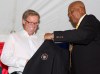 Rheal Cormier, left, receives his jacket from Ferguson Jenkins during his induction to the Canadian Baseball Hall of Fame&nbsp;in St. Marys, Ont., on June 23, 2012. THE CANADIAN PRESS/Dave Chidley