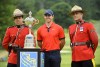 Rory McIlroy of Northern Ireland, centre, poses with Royal Canadian Mounted Police officers with the Championship trophy after winning the 2019 Canadian Open golf championship in Ancaster, Ont., on Sunday, June 9, 2019. The 2021 Canadian Open is set to be cancelled because of COVID-19 border restrictions. THE CANADIAN PRESS/Nathan Denette