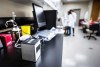 The Hyris Bcube unit is shown as Lab techs Mandy Chan and Maura Hooper work with the first swab samples to be tested for COVID-19 at the Canadian Sport Institute Calgary biochemistry lab in Calgary on January 15, 2020. The men curling in the Canadian championship don't much care there's a small, silver box processing their nasal and throat swabs in a matter of hours, but the result it produces matters deeply to them. A portable rapid-test unit the size of a tissue box not only greased the wheels for the curling bubble in Calgary, but it's also used in other sports across Canada to test for the COVID-19 virus. The Canadian Olympic Committee and Canadian Paralympic Committee purchased 17 Hyris Bcube units from Songbird Life Sciences in Guelph, Ont., and tasked Own The Podium with their deployment. Eight units at the Canadian Sport Institute Calgary churned through tests on opening day of the Tim Hortons Brier to get the men on the ice that night. THE CANADIAN PRESS/HO - CSI Calgary Photos, Dave Holland