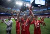 Toronto FC's Eriq Zavaleta, centre, hoists the Voyageurs Cup while celebrating with teammates goalkeeper Quillan Roberts, left, Jay Chapman, back left, and Marky Delgado, right, after defeating the Vancouver Whitecaps on aggregate in the Canadian Championship soccer final in Vancouver, B.C., on June 29, 2016. Toronto FC has been given a buy-in to the CONCACAF Champions League with Forge FC, its opponent in the Canadian Championship final, unable to return to full training. THE CANADIAN PRESS/Darryl Dyck