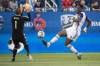 Orlando City SC forward Cyle Larin kicks the ball past Montreal Impact goalkeeper Evan Bush to score during first half MLS action Saturday, August 5, 2017 in Montreal. THE CANADIAN PRESS/Paul Chiasson