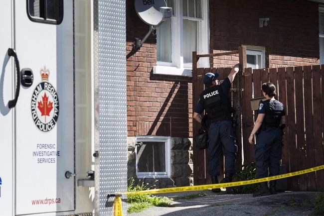 Durham Regional Police enter a home in Oshawa, Ont., on July 10, 2018. A verdict is expected today in the trial of a man accused of killing two Ontario women. Adam Strong has pleaded not guilty to first-degree murder in the deaths of Rori Hache and Kandis Fitzpatrick. Hache's torso was found in Lake Ontario in September 2017, and police charged Strong in her death later that year. In July 2018, police alleged they had found Fitzpatrick's DNA in Strong's basement. THE CANADIAN PRESS/Christopher Katsarov