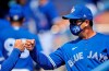 Toronto Blue Jays manager Charlie Montoyo greets a teammate in the dugout before a spring training baseball game against the Philadelphia Phillies Tuesday, March 9, 2021, at TD Ballpark in Dunedin, Fla. THE CANADIAN PRESS/Steve Nesius