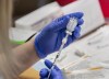 Amanda Parsons, a registered nurse on staff at the Northwood Care facility, prepares a dose of the Moderna vaccine in Halifax on January 11, 2021. THE CANADIAN PRESS/Andrew Vaughan