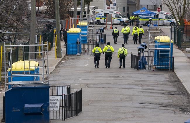 Police patrol the empty streets of Waterloo, Ont. on St. Patrick's Day on March 17, 2020. It's St. Patrick's Day but the pandemic is taking at least of the fizz out of the annual Irish-themed celebration. Restrictions on gatherings abound and officials across Canada are urging restraint. The main worry is that out-of-control revelry will spark a spike in COVID-19 cases. THE CANADIAN PRESS/Frank Gunn