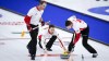 Team Canada skip Brad Gushue, centre, makes a shot as lead Geoff Walker, left, and second Brett Gallant sweep while they play Team Alberta at the Brier in Calgary, Alta., on March 13, 2021.THE CANADIAN PRESS/Jeff McIntosh