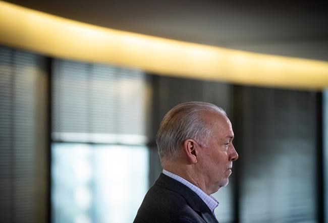 B.C. Premier John Horgan listens during a post-election news conference in Vancouver on October 25, 2020. THE CANADIAN PRESS/Darryl Dyck