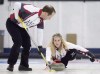 Brent Laing sweeps for teammate Jennifer Jones in the Wall Grain Mixed Doubles Curling Classic at the Oshawa Curling Club in Oshawa, Ont., Monday, Nov. 16, 2015. Jennifer Jones and husband Brent Laing are off to a 3-0 start at the Home Hardware Canadian mixed doubles curling championship. THE CANADIAN PRESS/Frank Gunn