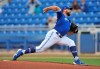 Toronto Blue Jays starter Tanner Roark pitches against the New York Yankees during the first inning of a spring training baseball game Sunday, March 21, 2021, at TD Ballpark in Dunedin, Fla. THE CANADIAN PRESS/Steve Nesius