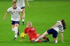 U.S. defender Emily Sonnett (14) and midfielder Rose Lavelle (16) separate Canada forward Adriana Leon (19) from the ball during the second half of a SheBelieves Cup soccer match February 18, 2021, in Orlando, Fla. THE CANADIAN PRESS/AP, Phelan M. Ebenhack