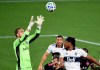 Seattle Sounders goalkeeper Stefan Frei, left, grabs the ball away from Vancouver Whitecaps defender Derek Cornelius, right, during the second half of an MLS soccer match in Portland, Ore., Tuesday, Oct. 27, 2020. THE CANADIAN PRESS/AP-Steve Dykes