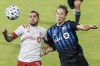 Montreal Impact’s Lassi Lappalainen, right, challenges Toronto FC’s Auro Jr. during first half MLS soccer action in Montreal, Wednesday, Sept. 9, 2020. Major League Soccer released its full 2021 schedule Wednesday but there were more questions than answers for the three Canadian teams. THE CANADIAN PRESS/Graham Hughes
