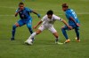 Canada's Patrick Metcalfe, centre, dribbles the ball against Honduras' Kervin Arriaga, left, and Luis Palma during a Concacaf Men's Olympic Qualifying championship soccer match in Guadalajara, Mexico, Thursday, March 25, 2021. THE CANADIAN PRESS/AP, Fernando Llano