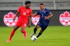 Canada forward Alphonso Davies (19) moves to get past Bermuda defender Eusebio Blankendal (2) during the first half of a World Cup 2022 Group B qualifying soccer match, Thursday, March 25, 2021, in Orlando, Fla. THE CANADIAN PRESS/AP, John Raoux