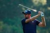 Corey Conners, of Canada, watches his shot on the first fairway during a practice round for the Masters golf tournament on Wednesday, April 7, 2021, in Augusta, Ga. THE CANADIAN PRESS/AP-Charlie Riedel