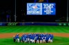 Toronto Blue Jays players, coaches and staff celebrate a 4-1 win over the New York Yankees in a baseball game in Buffalo, N.Y., Thursday, Sept. 24, 2020. THE CANADIAN PRESS/AP/Adrian Kraus