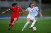 Canada's Julia Grosso, right, and Wales' Natasha Harding battle for the ball during the women's international friendly soccer match at Leckwith Stadium, Wales, Friday, April 9, 2021. Canada blanked Wales 3-0 but lost captain Christine Sinclair to an injury in the fist half of a soccer friendly Friday. THE CANADIAN PRESS/AP-PA, Nick Potts