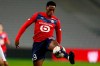 Lille's Jonathan David controls the ball during the French League One soccer match between Lille and Dijon at the Stade Pierre Mauroy stadium in Villeneuve d'Ascq, northern France, Sunday, Jan. 31, 2021. THE CANADIAN PRESS/AP/Michel Spingler