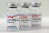 Three vials of the Moderna COVID-19 Vaccine are pictured in a new coronavirus, COVID-19, vaccination center at the Velodrome-Stadium in Berlin, Germany, Wednesday, Feb. 17, 2021. THE CANADIAN PRESS/AP/Michael Sohn, pool