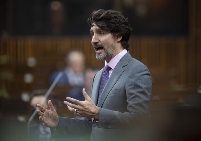Prime Minister Justin Trudeau responds to a question during Question Period in the House of Commons, in Ottawa, Wednesday, April 14, 2021. The Prime Minister says the federal government will deploy the Canadian Red Cross to help Ontario with their mobile vaccination teams. THE CANADIAN PRESS/Adrian Wyld