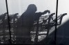 A worker casts a shadow as he sanitizes grocery carts in Toronto, Friday, Dec. 18, 2020. Despite being deemed essential and continuing to go into work as stay-at-home orders are renewed, most supermarket employees have yet to receive a vaccine or a pay boost. THE CANADIAN PRESS/Frank Gunn