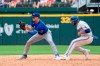 Texas Rangers' Isiah Kiner-Falefa is safe as Toronto Blue Jays third baseman Cavan Biggio waits for the late throw on an attempted fielder's choice during the eighth inning of a baseball game Monday, April 5, 2021, in Arlington, Texas. THE CANADIAN PRESS/AP-Jeffrey McWhorter