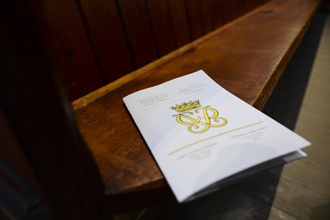 The official program for the National Commemorative Ceremony in honour of Prince Philip, The Duke of Edinburgh, sits on an empty pew prior to the ceremony at Christ Church Cathedral in Ottawa on Saturday, April 17, 2021. THE CANADIAN PRESS/Sean Kilpatrick