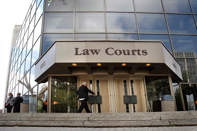 The Manitoba Law Courts building is shown in downtown Winnipeg, Monday, Aug. 18, 2014. THE CANADIAN PRESS/John Woods