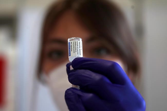 A health worker shows to the media how she prepares a dose of the Janssen vaccine by Johnson & Johnson, during a COVID-19 vaccination campaign at the Vela vaccination center, near Tor Vergata hospital in Rome, Saturday, April 24, 2021. THE CANADIAN PRESS/AP-Alessandra Tarantino