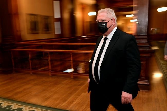 Ontario Premier Doug Ford walks to a press conference at Queen's Park in Toronto on Friday, April 16, 2021. THE CANADIAN PRESS/Frank Gunn