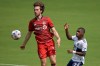 Toronto FC forward Patrick Mullins (13) and Vancouver Whitecaps forward Deiber Caicedo (7) compete for a ball during the first half of an MLS soccer match, Saturday, April 24, 2021, in Orlando, Fla. Now in his eighth MLS season,&nbsp; 29-year-old forward Mullins is one of the veterans on the Toronto FC roster.THE CANADIAN PRESS/AP/Phelan M. Ebenhack