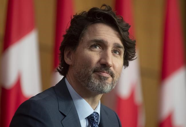 Prime Minister Justin Trudeau listens to a virtual speaker during a news conference in Ottawa, Friday April 30, 2021. THE CANADIAN PRESS/Adrian Wyld