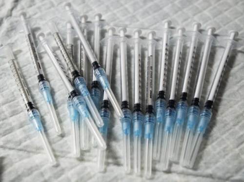 Syringes are readied at a COVID-19 mobile vaccination clinic for members of First Nations and their partners, in Montreal, Friday, April 30, 2021. THE CANADIAN PRESS/Ryan Remiorz