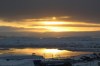 The sun sets over Iqaluit, Nunavut, on Monday, Oct. 26, 2020. Iqaluit's city council has declared a local state of emergency over rising numbers of COVID-19 cases. THE CANADIAN PRESS/Emma Tranter