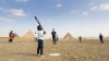 Because Baseball players, parents and coaches enjoy a game in the shadow of the pyramids in this undated handout image. It was the first time a game had played on the Giza plateau since the White Sox and Giants visited Cairo in 1914. A curriculum developed by Baseball Canada is being used to help teach the game to Egypt's first youth baseball league. THE CANADIAN PRESS/HO-Because Baseball*MANDATORY CREDIT*