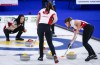 Team Canada skip Kerri Einarson, left, directs her teammates, lead Briane Meilleur, right, and second Shannon Birchard, against Estonia at the Women's World Curling Championship in Calgary, Alta., Wednesday, May 5, 2021.THE CANADIAN PRESS/Jeff McIntosh
