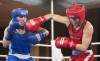 Mandy Bujold, right, of Ontario, lands a blow to the head of Kim Klavel, of Quebec, during their 51kg bout at the Canadian Olympic boxing trials, in Montreal, on Wednesday, Dec. 9, 2015. THE CANADIAN PRESS/Graham Hughes